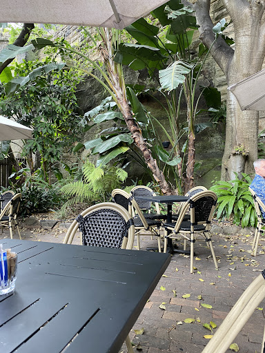 Garden courtyard seating at 4 Doors Down